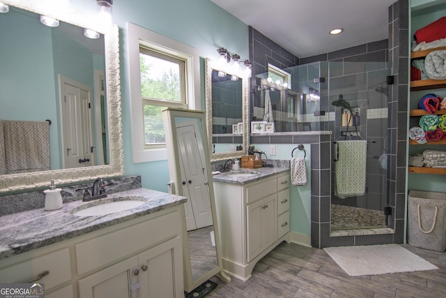 299 Savior Ln, Hamilton, GA 31811 - full bathroom with a shower stall, two vanities, wood finished floors, and recessed lighting