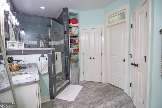 299 Savior Ln, Hamilton, GA 31811 - full bathroom with a closet, vanity, a stall shower, wood finished floors, and recessed lighting