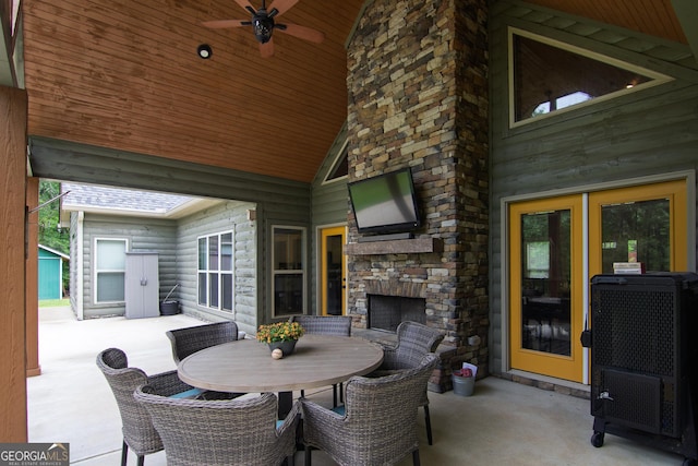 299 Savior Ln, Hamilton, GA 31811 - view of patio / terrace featuring an outdoor stone fireplace, outdoor dining space, and ceiling fan
