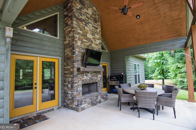299 Savior Ln, Hamilton, GA 31811 - view of patio / terrace with an outdoor stone fireplace, outdoor dining space, french doors, and a ceiling fan