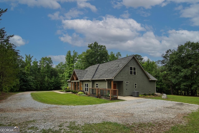 299 Savior Ln, Hamilton, GA 31811 - view of front of home with driveway, a wooden deck, a front lawn, and a shingled roof