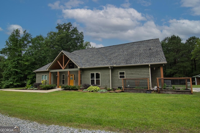 299 Savior Ln, Hamilton, GA 31811 - view of front of home with a front lawn, a shingled roof, and a garden