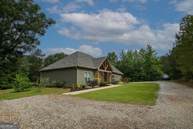 299 Savior Ln, Hamilton, GA 31811 - view of front of house with gravel driveway, a front lawn, and a shingled roof