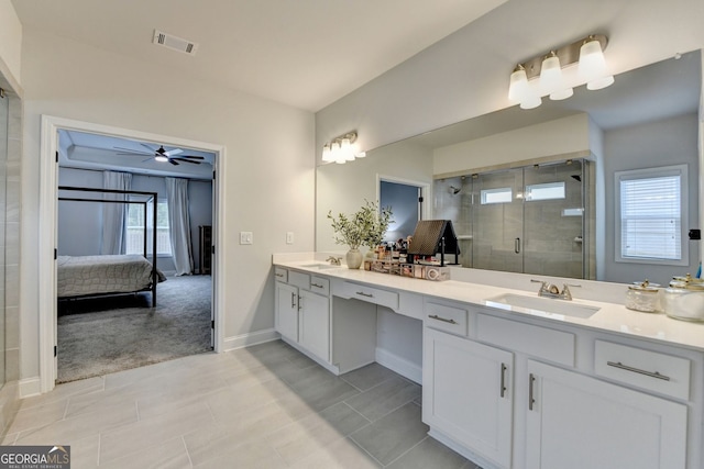 263 Blue Billed Xing, Jefferson, GA 30549 - bathroom with double vanity, ensuite bathroom, a stall shower, baseboards, and ceiling fan