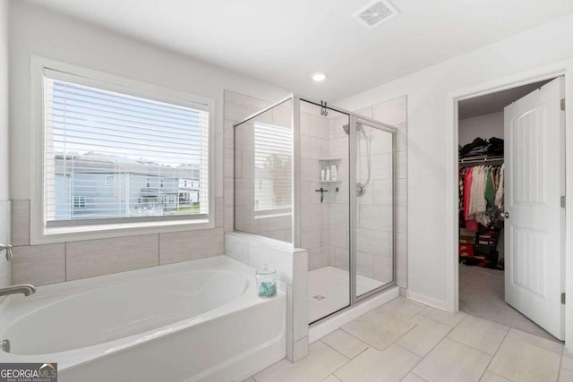 537 Garnet Dr, Acworth, GA 30101 - full bath with a garden tub, a stall shower, a walk in closet, baseboards, and recessed lighting