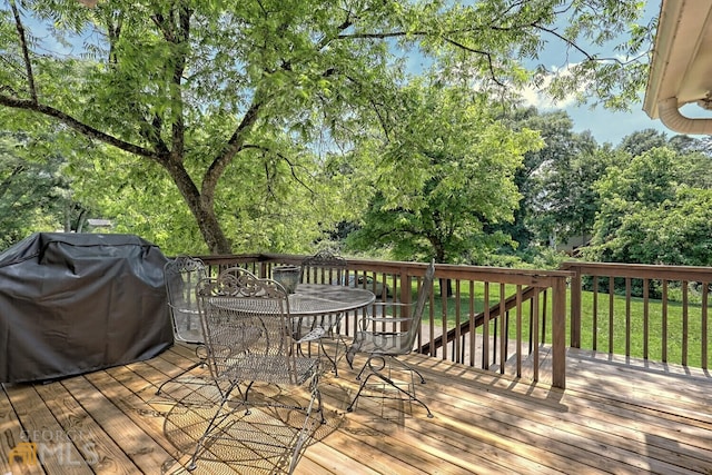 643 Washington St, Clarkesville, GA 30523 - deck with outdoor dining area, grilling area, and view of wooded area