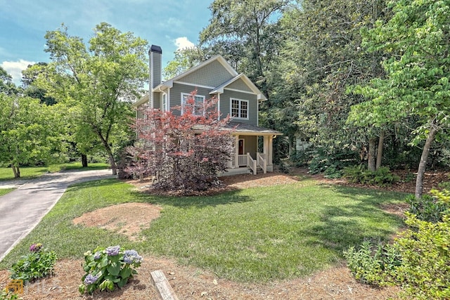 643 Washington St, Clarkesville, GA 30523 - view of front of home with a chimney, a porch, a front yard, and driveway