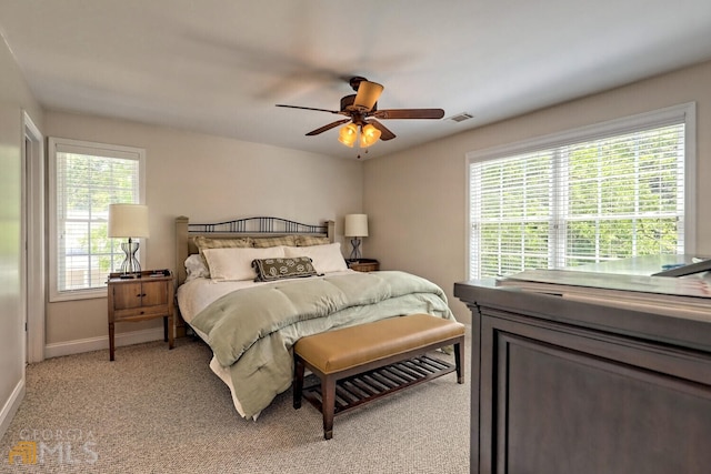 643 Washington St, Clarkesville, GA 30523 - bedroom with baseboards, light carpet, and a ceiling fan