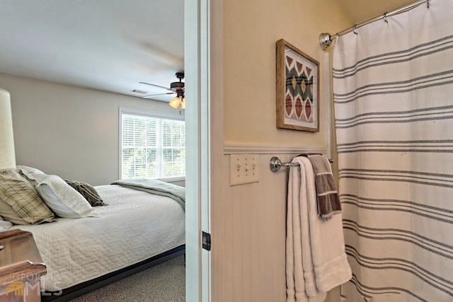 643 Washington St, Clarkesville, GA 30523 - carpeted bedroom with wainscoting and a ceiling fan
