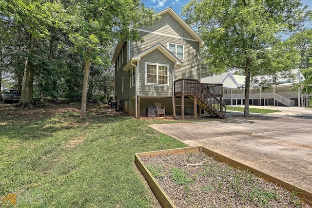 643 Washington St, Clarkesville, GA 30523 - back of house featuring stairs, a lawn, and central AC