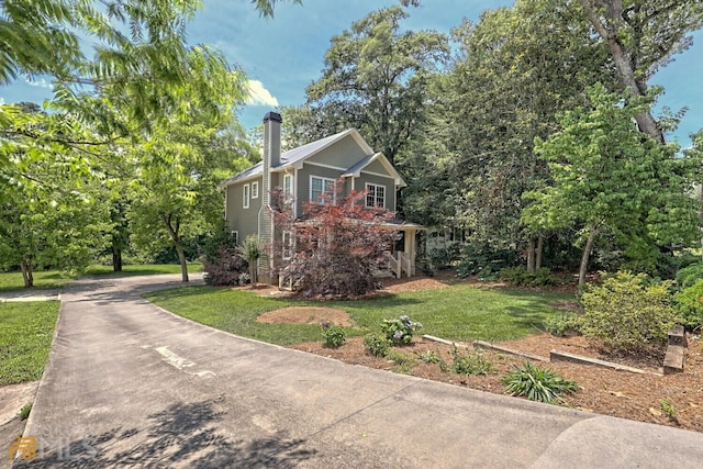643 Washington St, Clarkesville, GA 30523 - view of front of house with a chimney, a front yard, and driveway