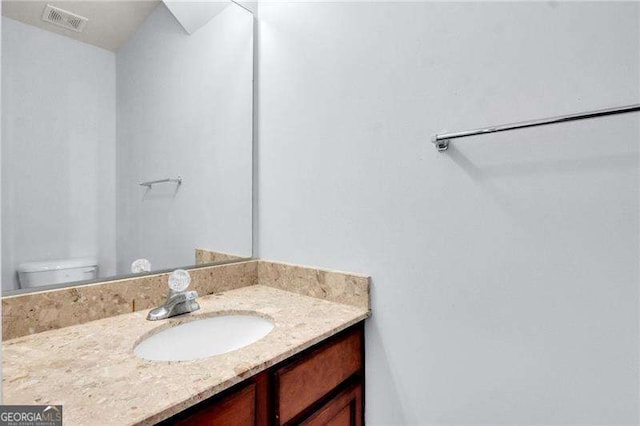 328 Oaktown Ct, Lawrenceville, GA 30044 - bathroom featuring vanity and toilet