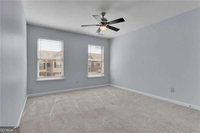 328 Oaktown Ct, Lawrenceville, GA 30044 - carpeted empty room with baseboards and a ceiling fan