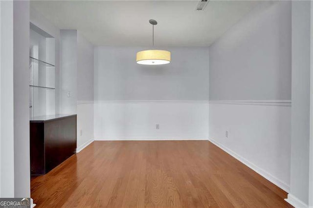328 Oaktown Ct, Lawrenceville, GA 30044 - unfurnished dining area with wood finished floors and baseboards