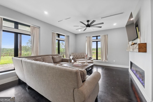 1971 Centennial Rd, Rutledge, GA 30663 - living room with plenty of natural light, baseboards, a glass covered fireplace, ceiling fan, and recessed lighting