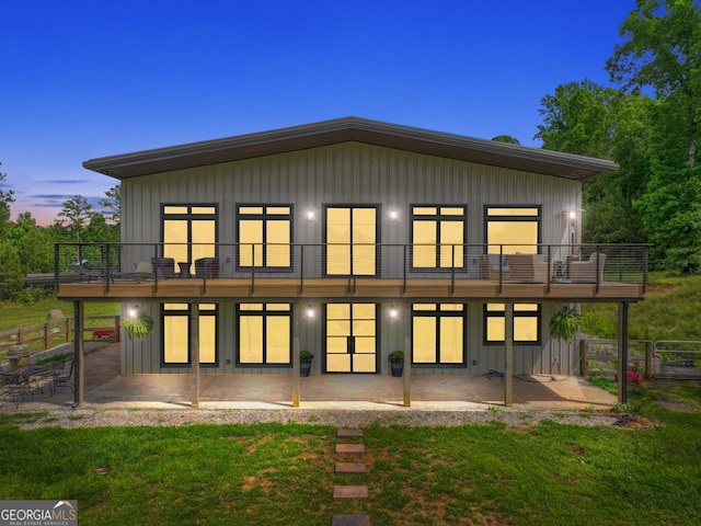 1971 Centennial Rd, Rutledge, GA 30663 - back of property featuring a patio, board and batten siding, and a balcony