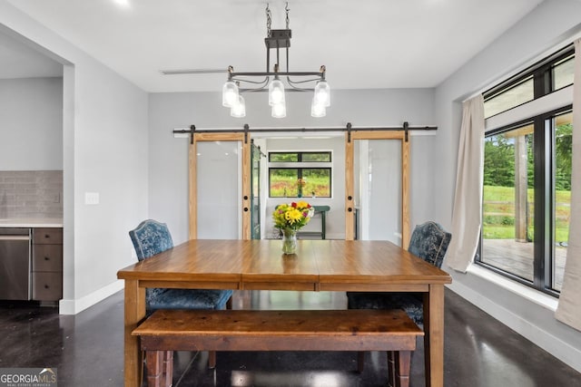 1971 Centennial Rd, Rutledge, GA 30663 - dining space featuring concrete flooring, a barn door, and baseboards