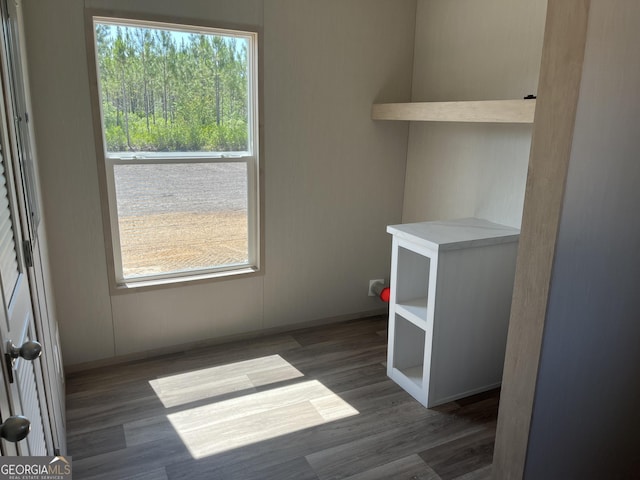 585 Elmer Thrift Rd, Waycross, GA 31503 - laundry room with wood finished floors and baseboards