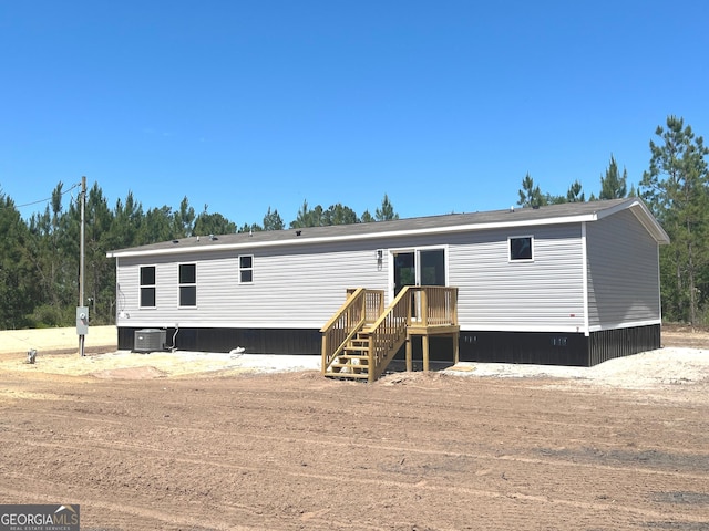 585 Elmer Thrift Rd, Waycross, GA 31503 - view of front of home featuring central AC unit and a wooden deck