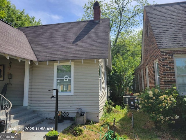 1336 Winton Ave, Macon, GA 31204 - view of front facade with a chimney and a shingled roof