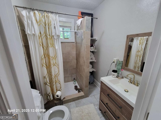 1336 Winton Ave, Macon, GA 31204 - full bathroom with vanity, toilet, a shower stall, a textured ceiling, and tile patterned floors