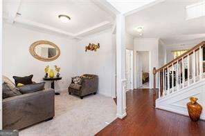 121 Royal Sunset Dr, Dallas, GA 30157 - living room featuring stairs and wood finished floors