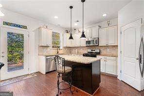 121 Royal Sunset Dr, Dallas, GA 30157 - kitchen with stainless steel appliances, plenty of natural light, decorative backsplash, and recessed lighting