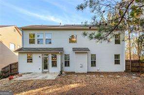 121 Royal Sunset Dr, Dallas, GA 30157 - back of property with a patio area and a fenced backyard
