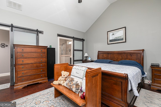 2256 Long Bow Chase NW, Kennesaw, GA 30144 - bedroom featuring a barn door, vaulted ceiling, wood finished floors, ensuite bathroom, and baseboards