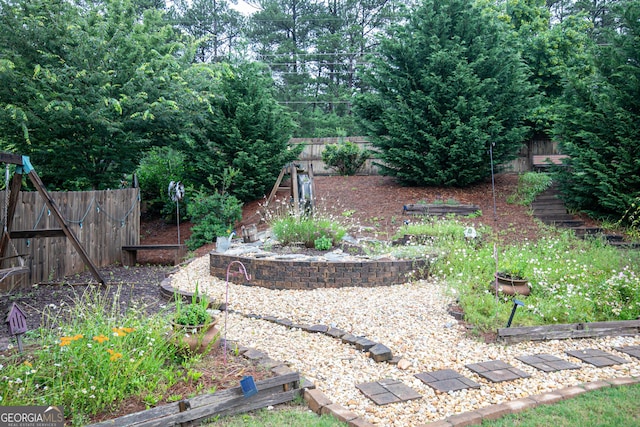 2256 Long Bow Chase NW, Kennesaw, GA 30144 - view of yard with a garden