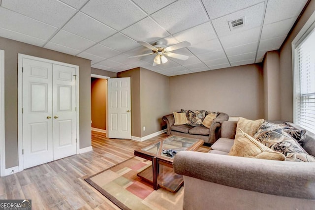 5980 Whitestone Ln, Suwanee, GA 30024 - living area featuring ceiling fan, light wood-style flooring, and a drop ceiling