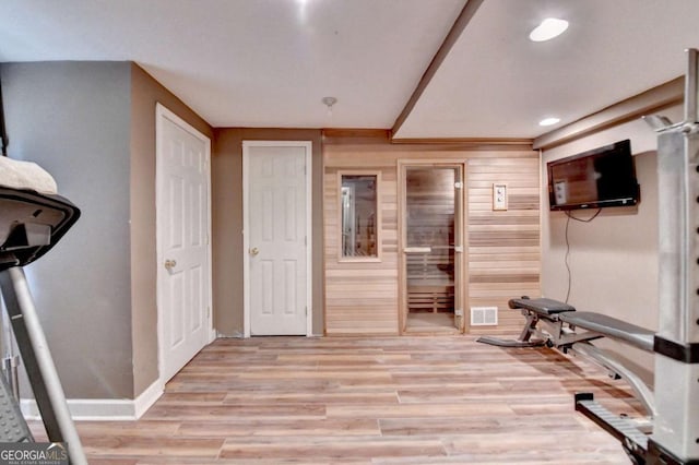 5980 Whitestone Ln, Suwanee, GA 30024 - exercise area featuring light wood-style floors, recessed lighting, and wooden walls