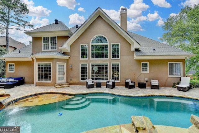 5980 Whitestone Ln, Suwanee, GA 30024 - rear view of house featuring an outdoor hangout area, stucco siding, a chimney, a patio, and an outdoor pool