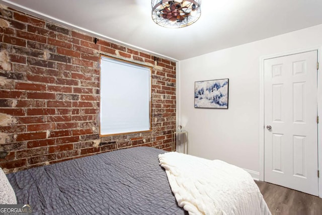 40 Daniel St SE, Atlanta, GA 30312 - bedroom featuring brick wall and wood finished floors