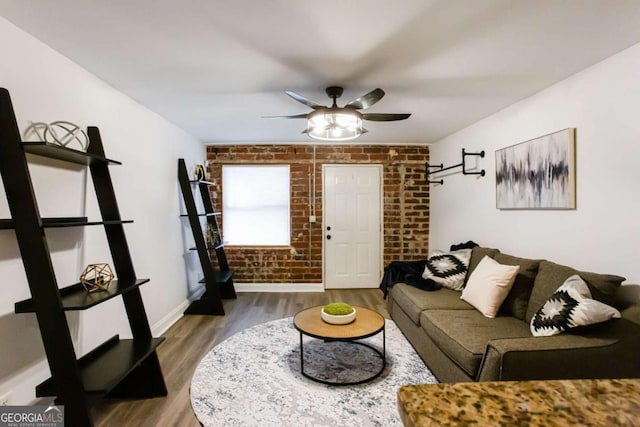 40 Daniel St SE, Atlanta, GA 30312 - living area with brick wall, a ceiling fan, wood finished floors, and baseboards