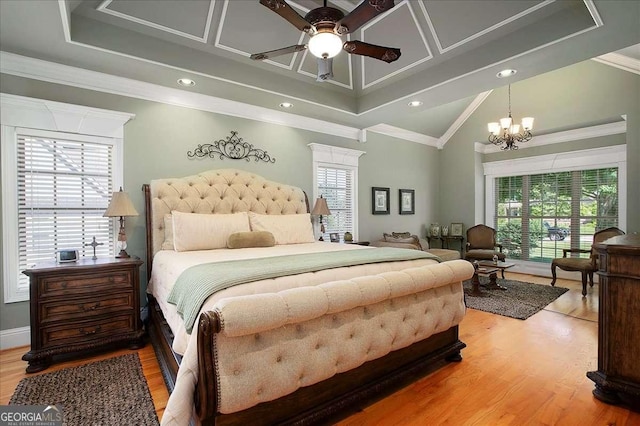 1917 Hearthstone Ct, Winder, GA 30680 - bedroom with multiple windows, ornamental molding, a chandelier, light wood-style floors, and recessed lighting