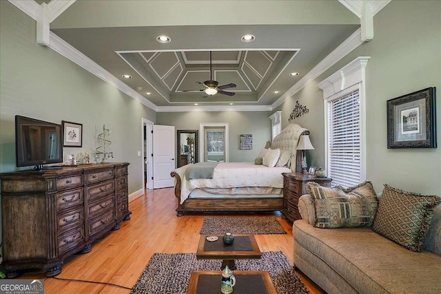 1917 Hearthstone Ct, Winder, GA 30680 - bedroom with crown molding, light wood-style flooring, a tray ceiling, and recessed lighting