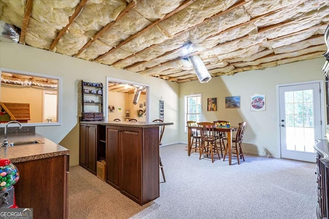 1917 Hearthstone Ct, Winder, GA 30680 - kitchen with a sink and light carpet