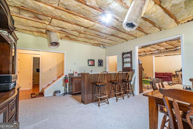 1917 Hearthstone Ct, Winder, GA 30680 - indoor wet bar featuring light colored carpet and stairway