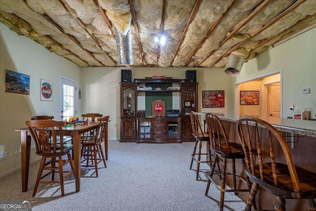 1917 Hearthstone Ct, Winder, GA 30680 - dining area featuring light colored carpet, a dry bar, and baseboards
