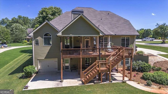 1917 Hearthstone Ct, Winder, GA 30680 - rear view of property with a lawn, a wooden deck, a garage, stairs, and a patio area
