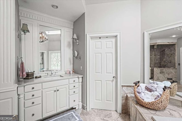 162 Daltree Ct, Marietta, GA 30068 - bathroom with vanity, a tile shower, a chandelier, marble finish floors, and crown molding