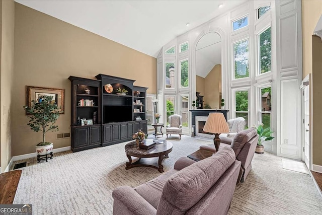 162 Daltree Ct, Marietta, GA 30068 - living room with high vaulted ceiling, a fireplace, and carpet