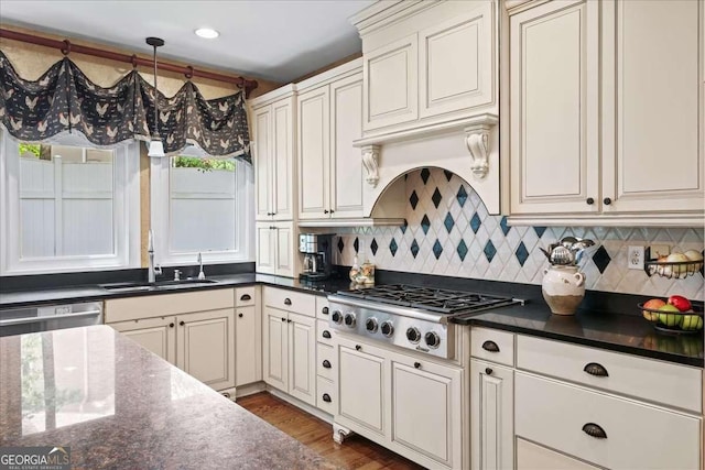 162 Daltree Ct, Marietta, GA 30068 - kitchen featuring a sink, appliances with stainless steel finishes, decorative backsplash, wood finished floors, and dark stone countertops