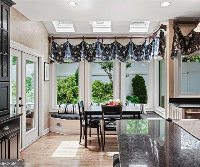 162 Daltree Ct, Marietta, GA 30068 - dining space featuring a skylight, light wood-style floors, and recessed lighting