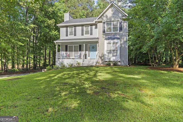 75 Chatsworth Pl, Newnan, GA 30265 - view of front of property featuring covered porch, a chimney, and a front lawn