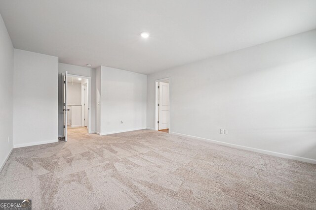 5207 Canberra Dr, Flowery Branch, GA 30542 - empty room with baseboards and light carpet