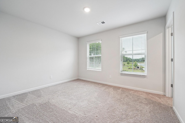5207 Canberra Dr, Flowery Branch, GA 30542 - empty room with light carpet and baseboards