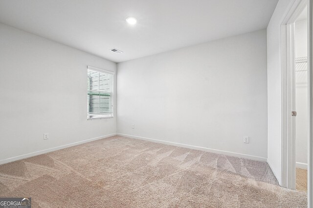 5207 Canberra Dr, Flowery Branch, GA 30542 - unfurnished room featuring light carpet and recessed lighting