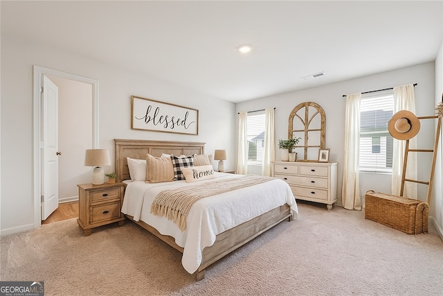 5207 Canberra Dr, Flowery Branch, GA 30542 - bedroom with light carpet and baseboards